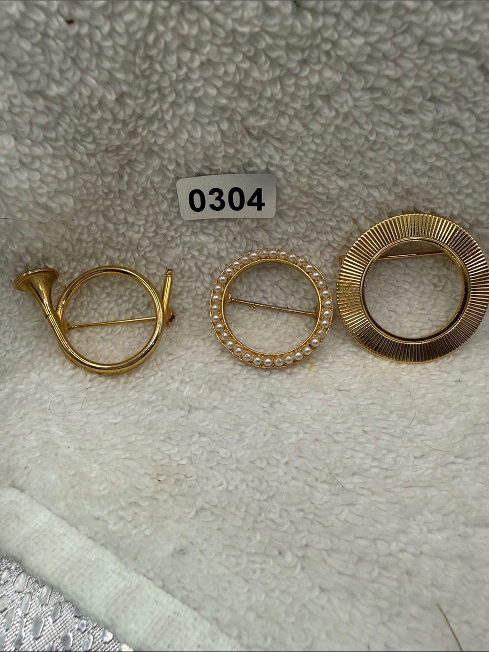 3 Circular Brooches-Gold toned Pearl-1 Trumpet, 1 Metal Textured